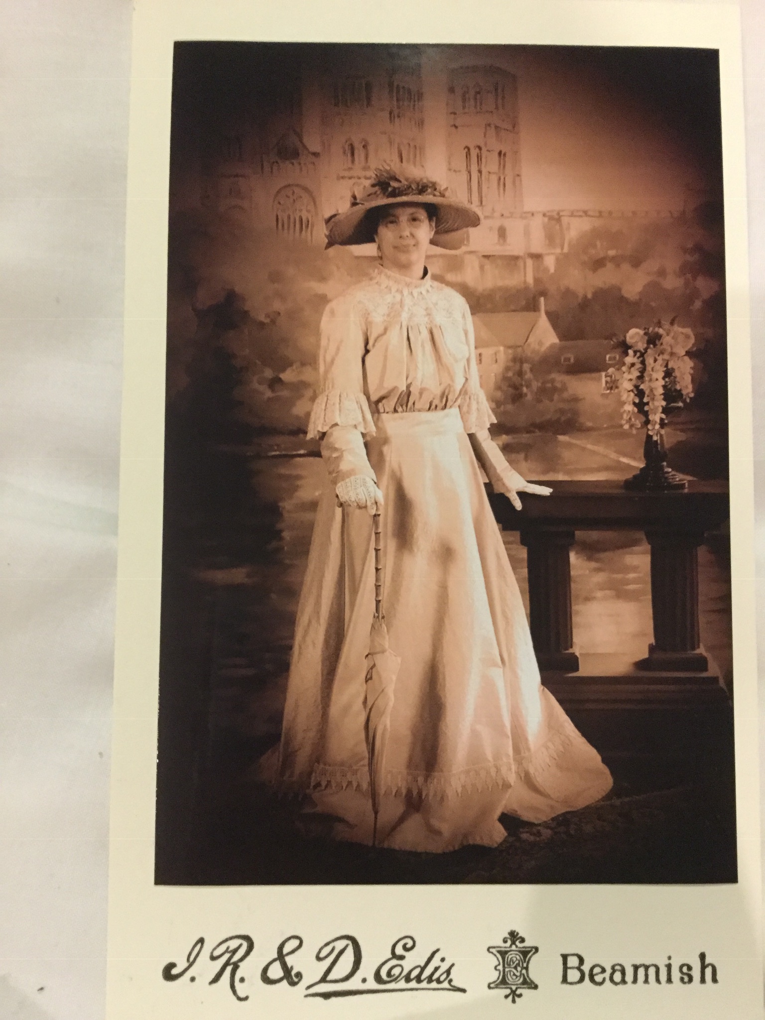 Cordelia has her picture taken in vintage dress.